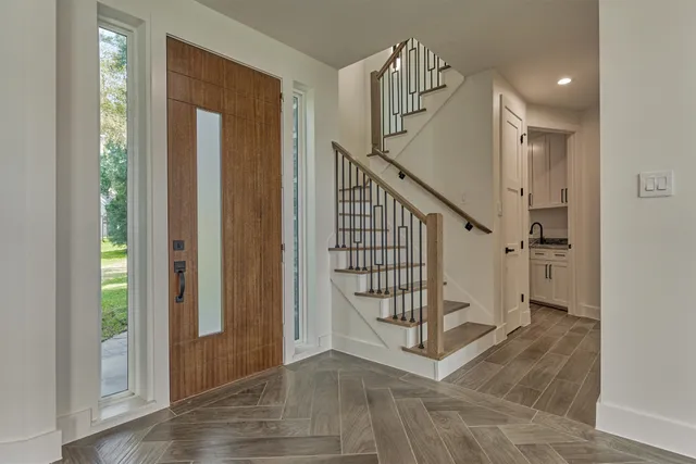 a view of entryway with stairs and wooden floor