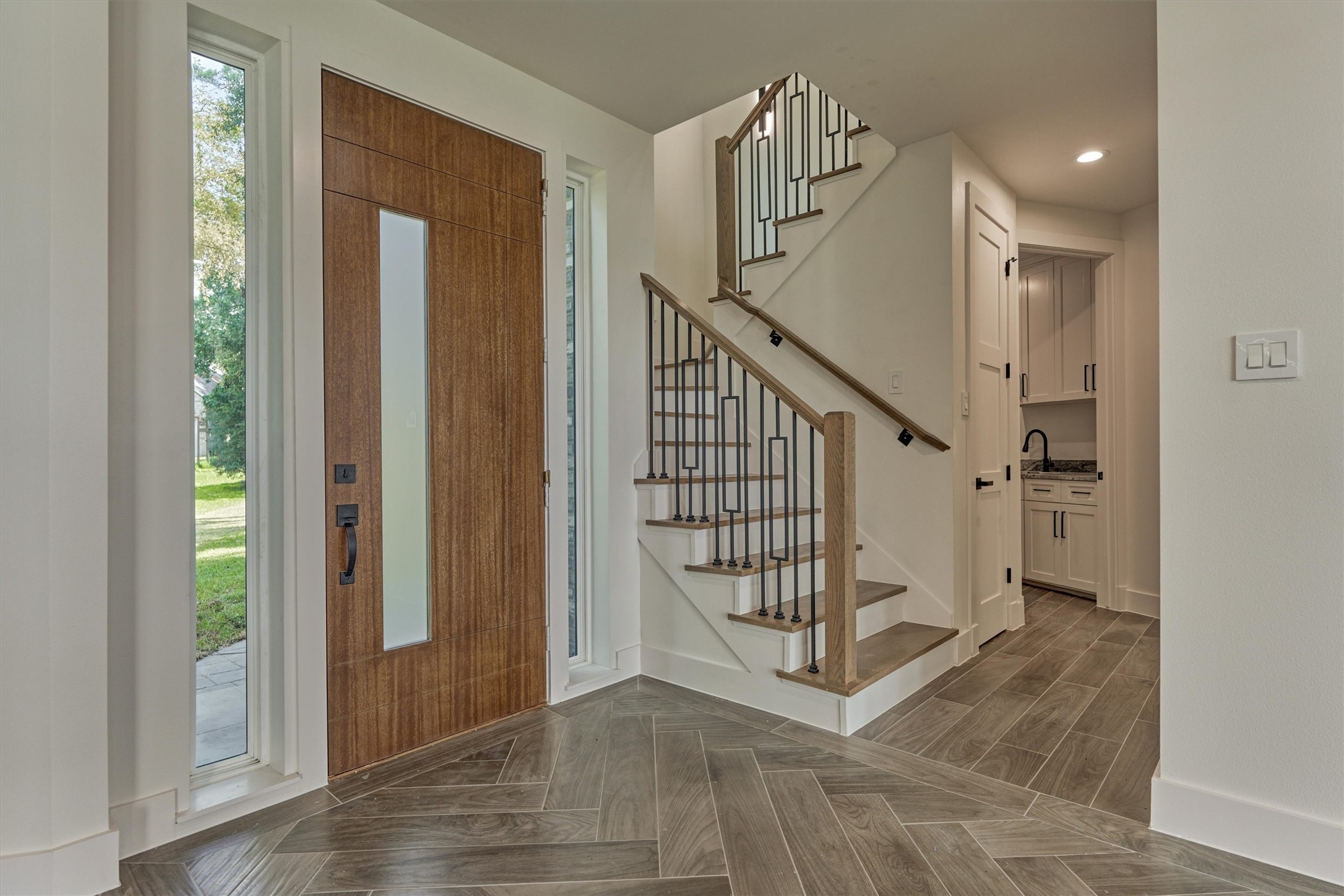2811 Hemingway Drive Montgomery, TX 77356 - Photo 13 of 50 a view of entryway with stairs and wooden floor