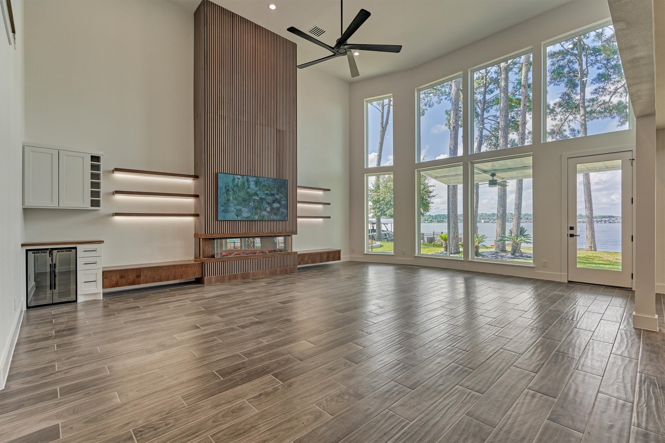 2811 Hemingway Drive Montgomery, TX 77356 - Photo 14 of 50 a view of an empty room with wooden floor and a window