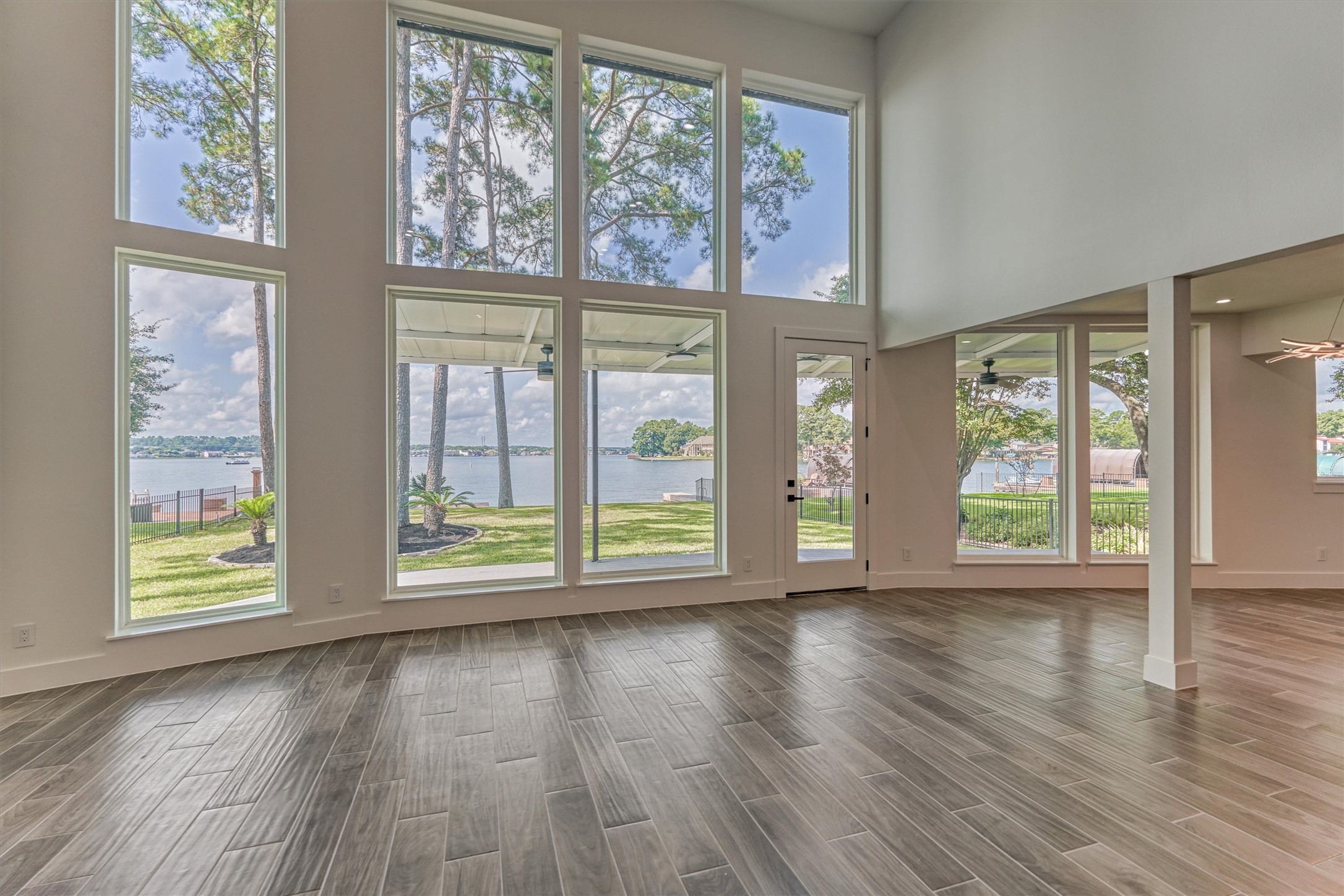 2811 Hemingway Drive Montgomery, TX 77356 - Photo 15 of 50 an empty room with wooden floor and windows