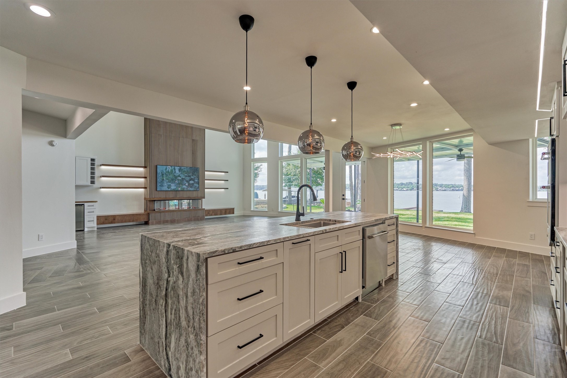2811 Hemingway Drive Montgomery, TX 77356 - Photo 21 of 50 a kitchen with stainless steel appliances granite countertop a sink a stove and a wooden floors