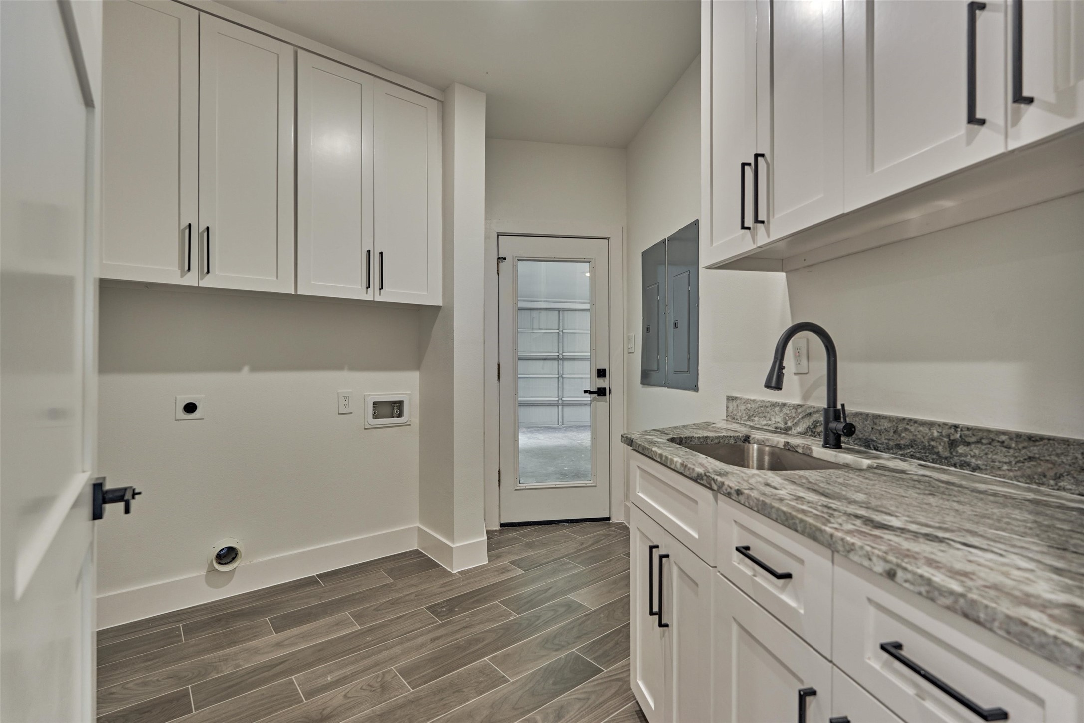 2811 Hemingway Drive Montgomery, TX 77356 - Photo 25 of 50 a kitchen with a sink and cabinets