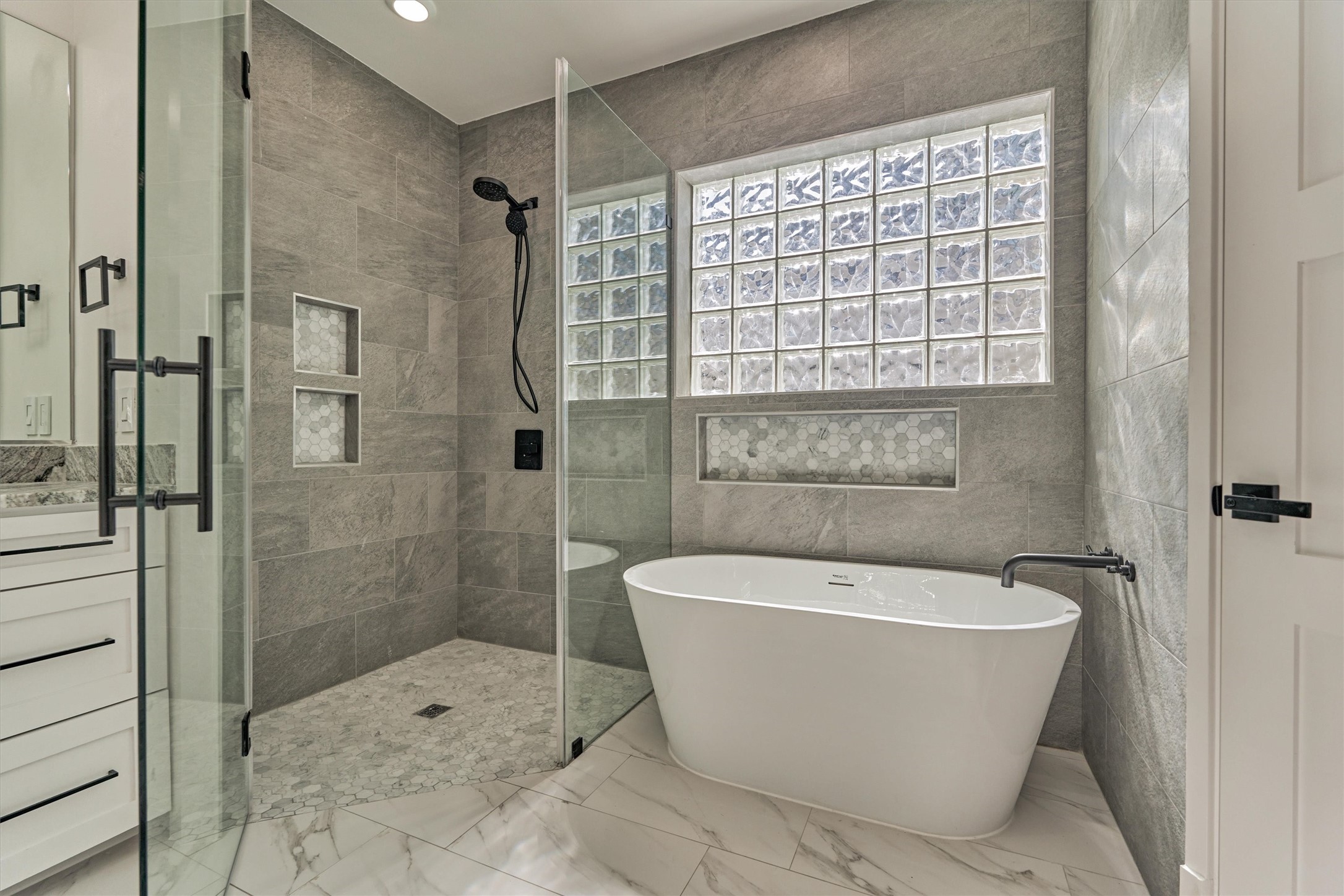 2811 Hemingway Drive Montgomery, TX 77356 - Photo 31 of 50 a white bath tub sitting next to a shower