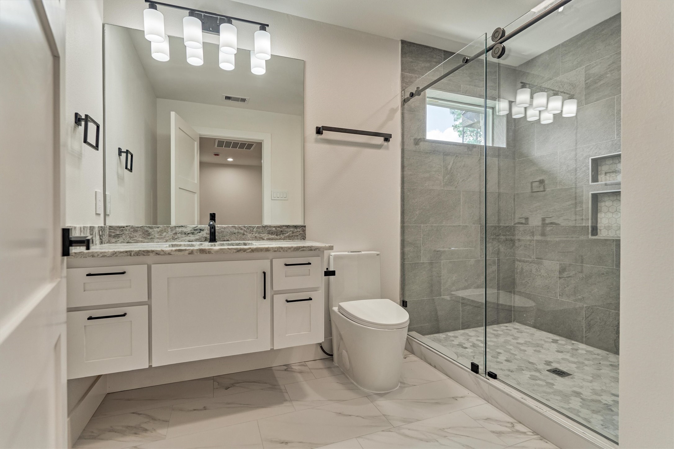 2811 Hemingway Drive Montgomery, TX 77356 - Photo 43 of 50 a bathroom with a toilet sink and shower