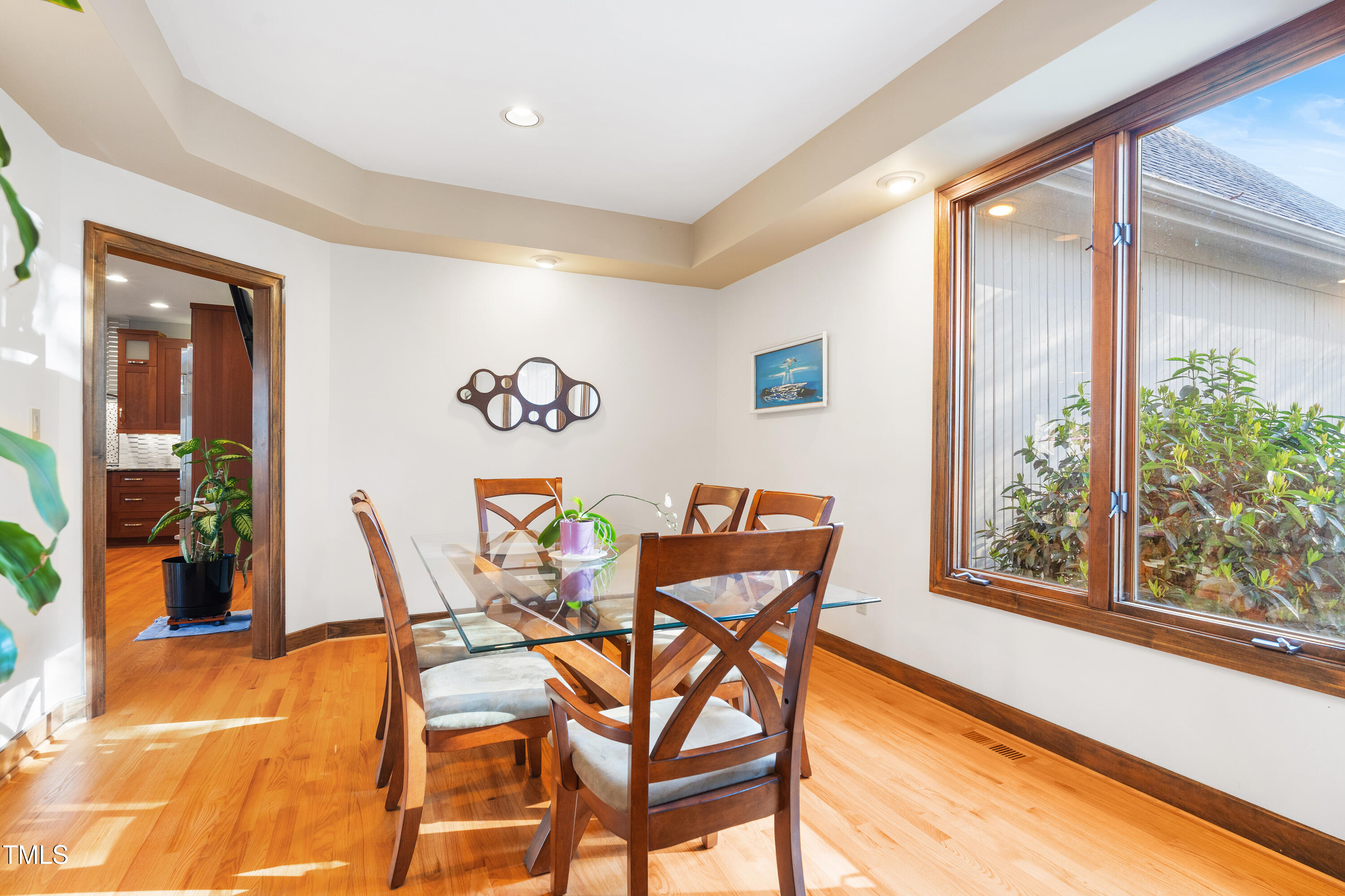 12117 Cliffside Circle Raleigh, NC 27614 - Photo 15 of 63 a dining room with furniture and a floor to ceiling window