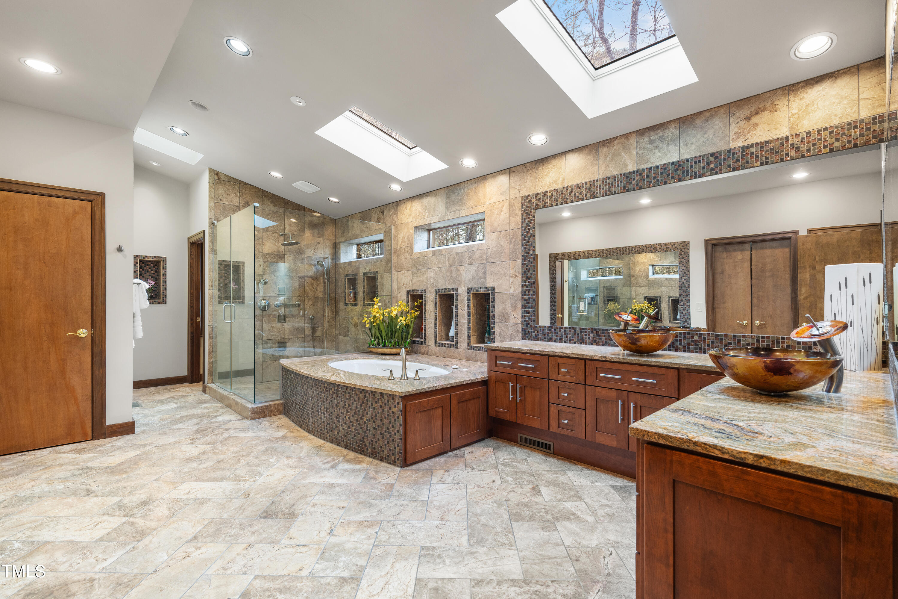 12117 Cliffside Circle Raleigh, NC 27614 - Photo 23 of 63 a large kitchen with kitchen island a sink stainless steel appliances and cabinets