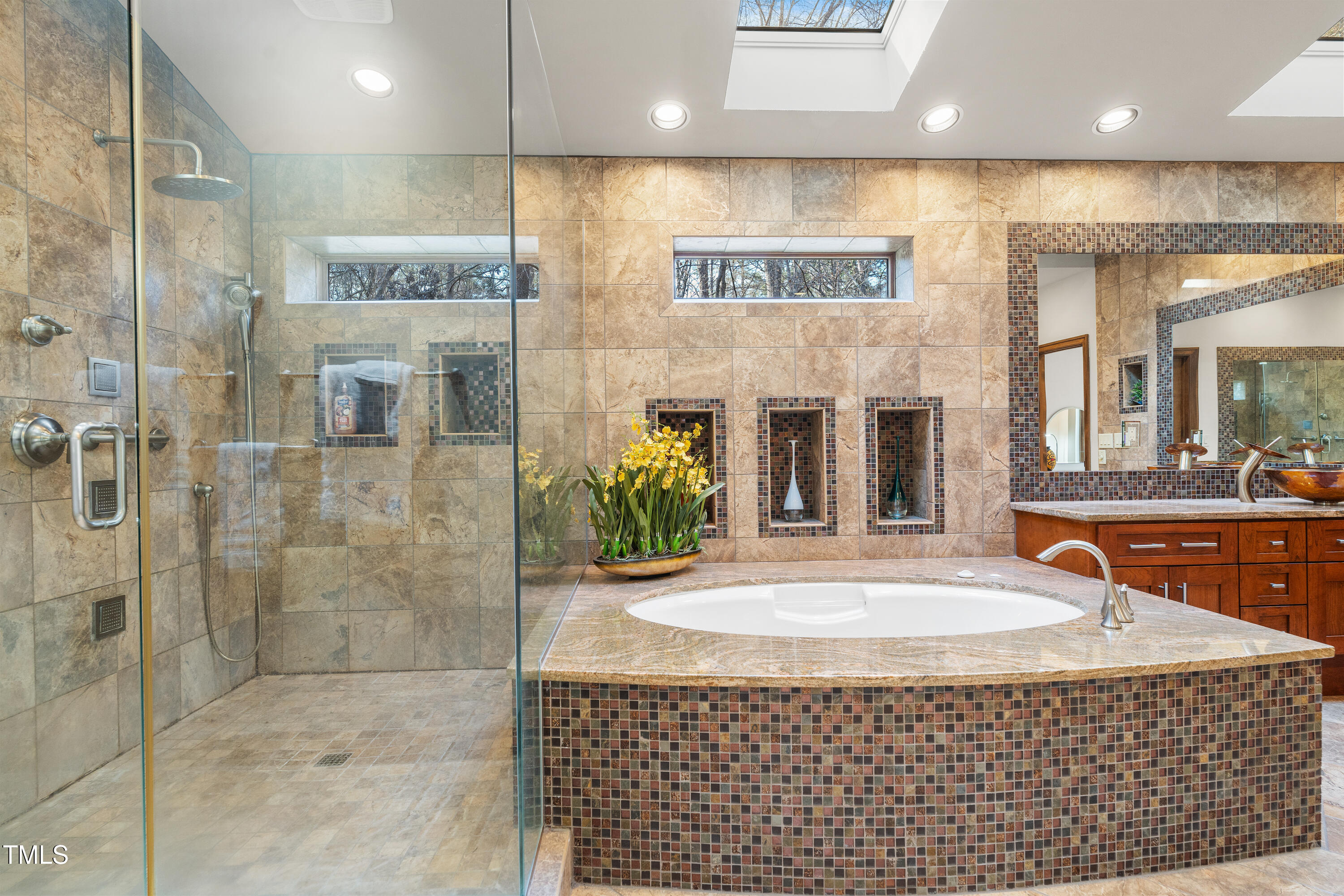 12117 Cliffside Circle Raleigh, NC 27614 - Photo 25 of 63 a view of a bathroom with a tub and shower