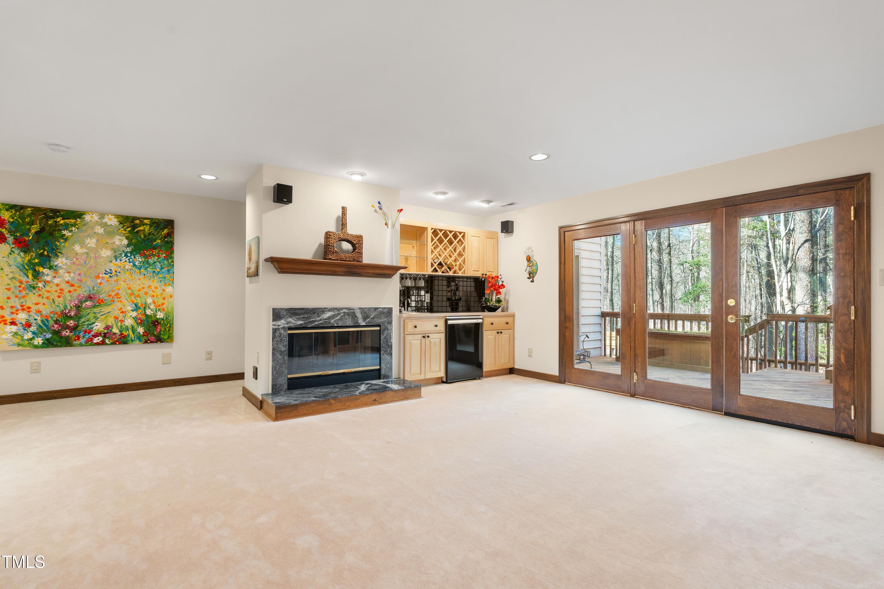 12117 Cliffside Circle Raleigh, NC 27614 - Photo 41 of 63 a view of an empty room with a fireplace and a large window
