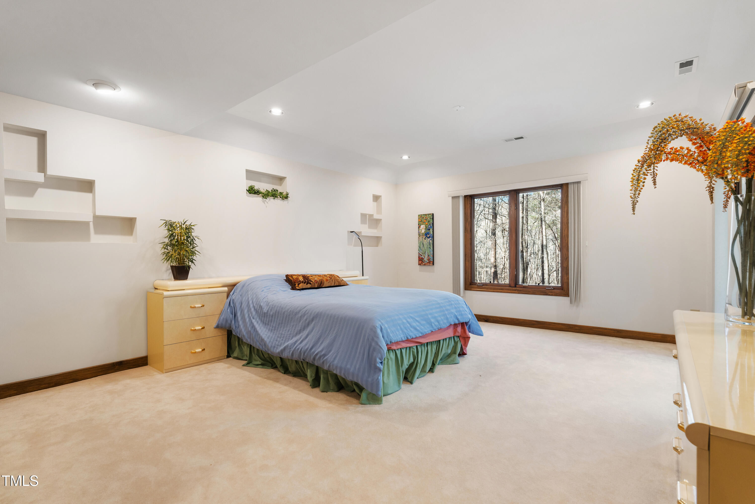 12117 Cliffside Circle Raleigh, NC 27614 - Photo 45 of 63 a spacious bedroom with a bed and a window
