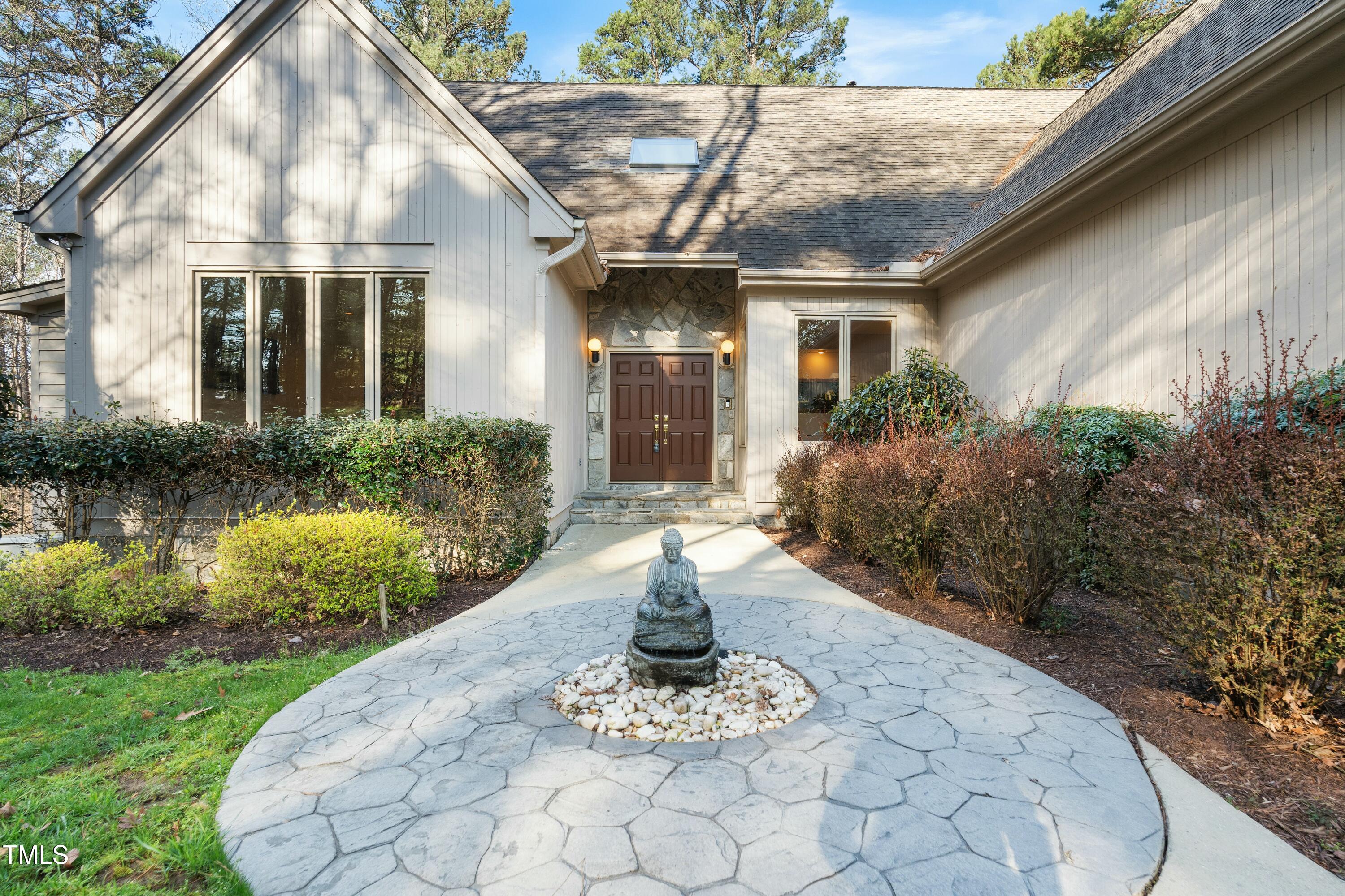 12117 Cliffside Circle Raleigh, NC 27614 - Photo 8 of 63 a front view of a house with garden