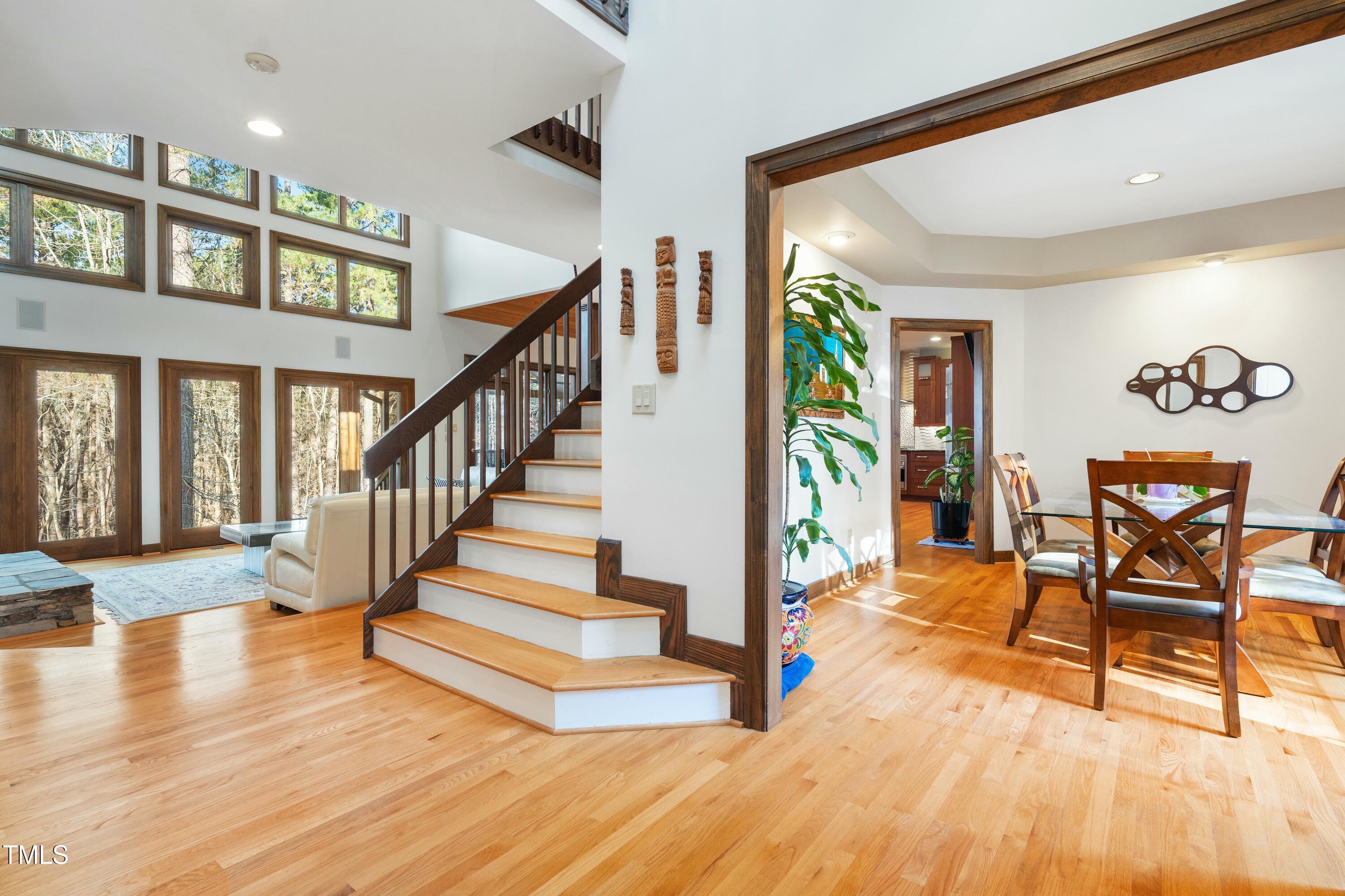12117 Cliffside Circle Raleigh, NC 27614 - Photo 10 of 63 a view of an entryway dining room and hall with wooden floor