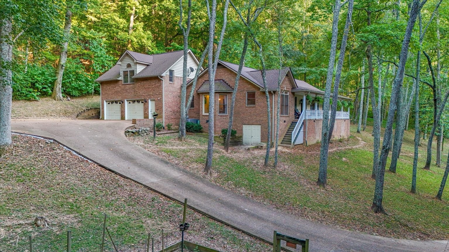 4523 Jackson Road Whites Creek, TN 37189 - Photo 1 of 44 a house that has a tree in front of it