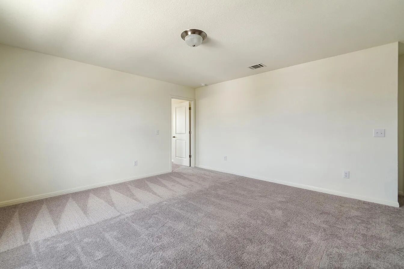 101 Aoudad Road Hutto, TX 78634 - Photo 18 of 39 A spacious room offers comfortable carpeting, ready for your personalized touch.