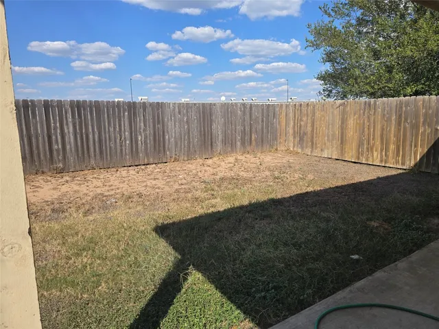 a view of outdoor space with wooden fence