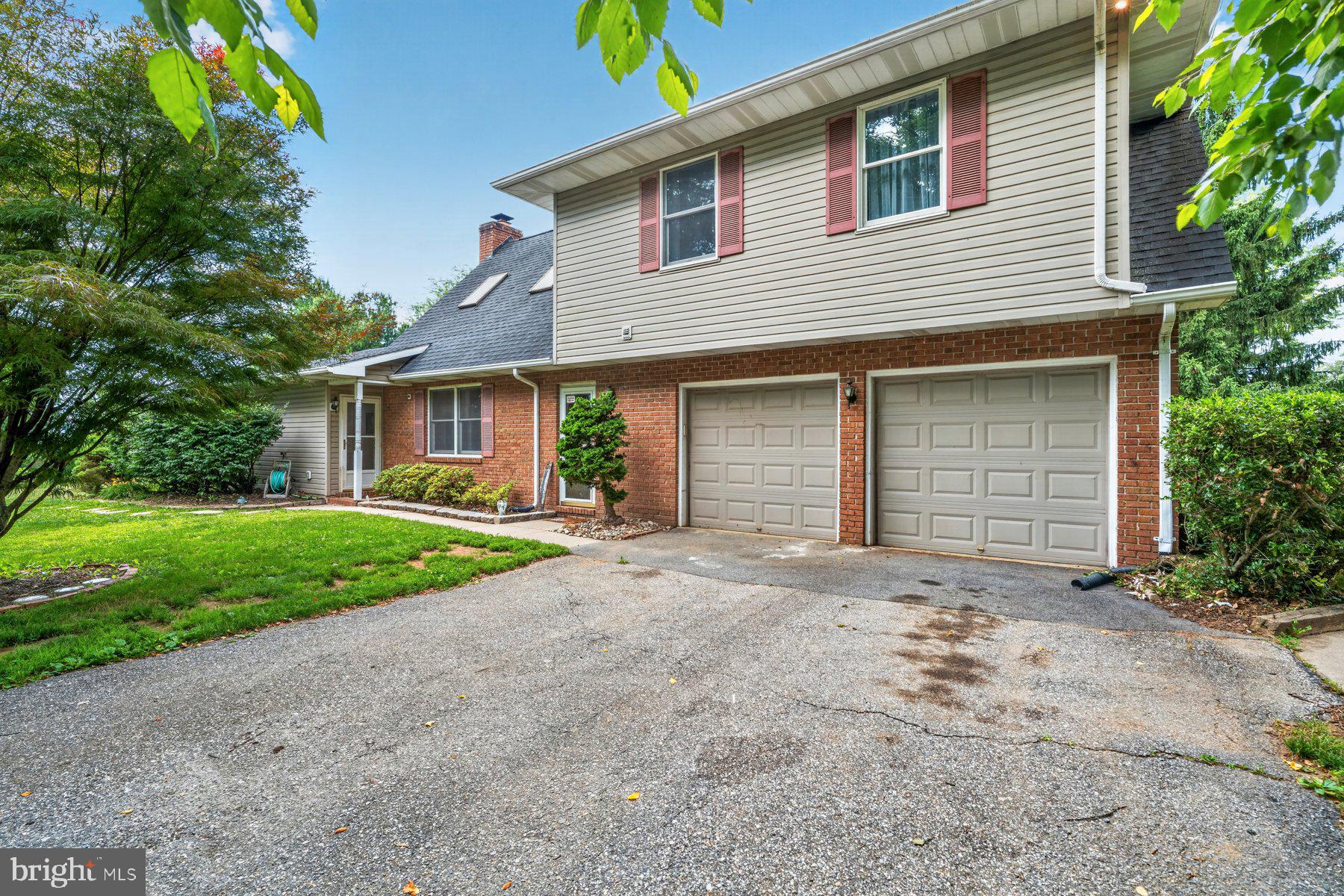 49 Rockland Road Westminster, MD 21158 - Photo 66 of 66 a front view of a house with a yard and garage