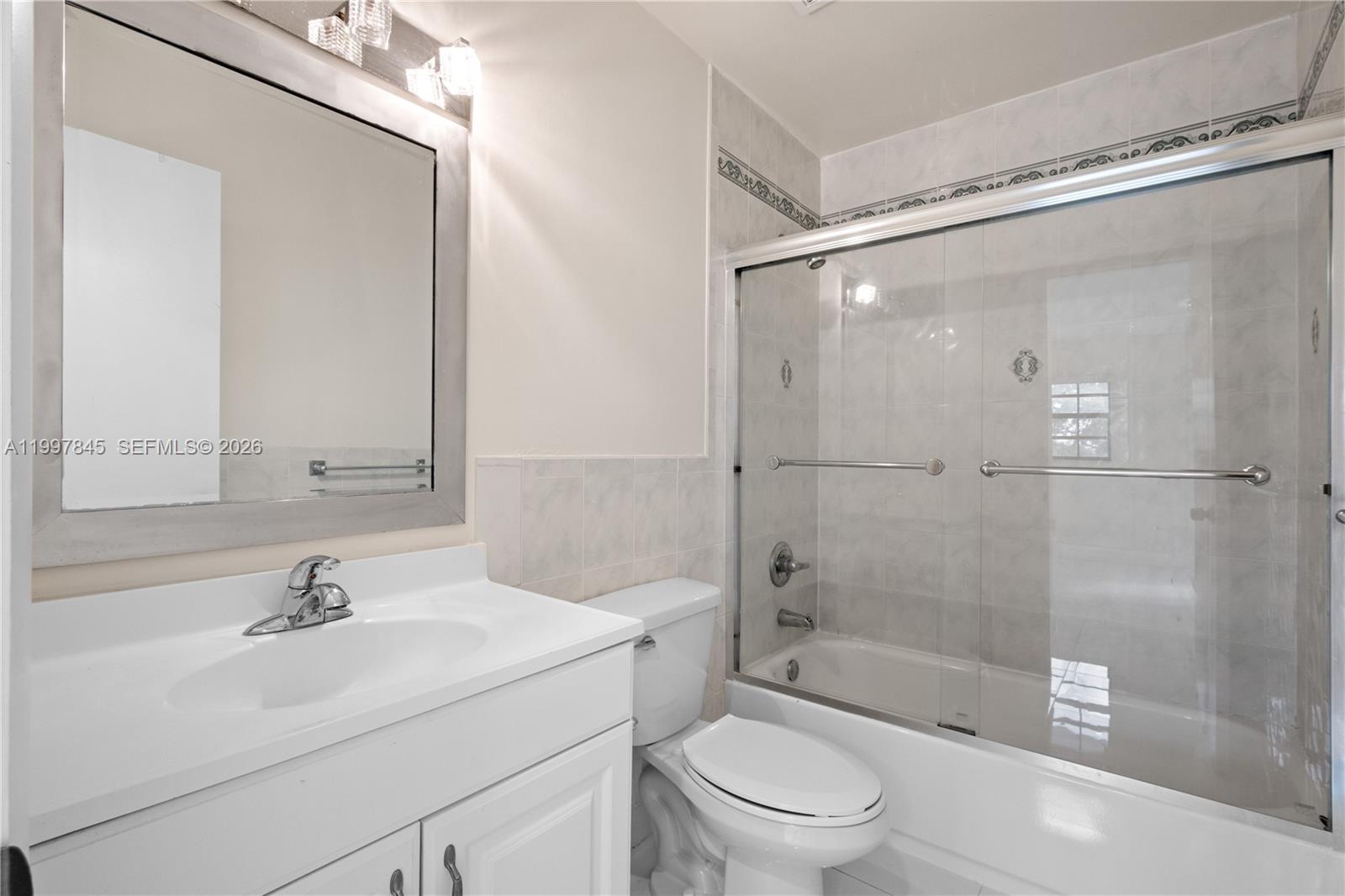 6211 Southwest 138th Court, Unit B Miami, FL 33183 - Photo 24 of 27 a bathroom with a sink a toilet and shower