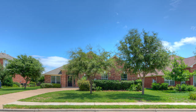 1810 Rutherford Drive Leander, TX 78641 - Photo 1 of 1 a front view of a house with a yard