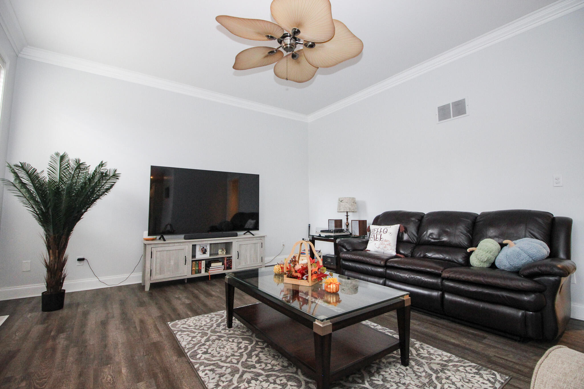 1403 Edgewater Road Crown Point, IN 46307 - Photo 14 of 43 a living room with furniture and a flat screen tv with wooden floor