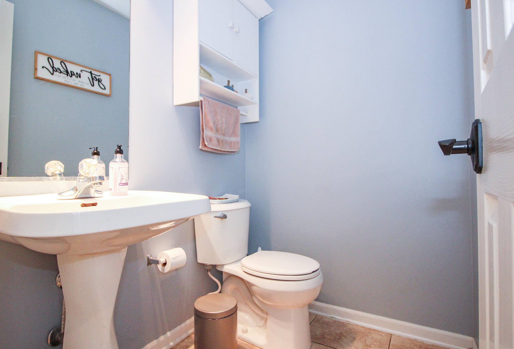 1403 Edgewater Road Crown Point, IN 46307 - Photo 15 of 43 a bathroom with a sink a toilet and mirror