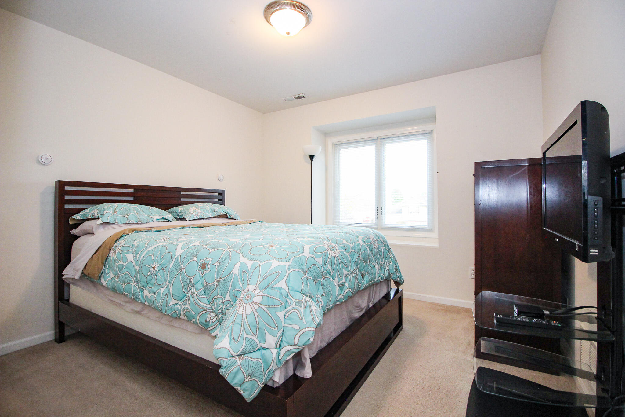 1403 Edgewater Road Crown Point, IN 46307 - Photo 20 of 43 a bed sitting in a bedroom next to a window