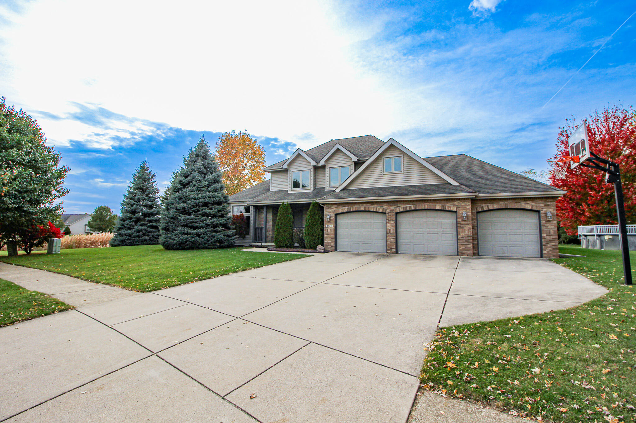 1403 Edgewater Road Crown Point, IN 46307 - Photo 30 of 43 a front view of a house with a yard and garage