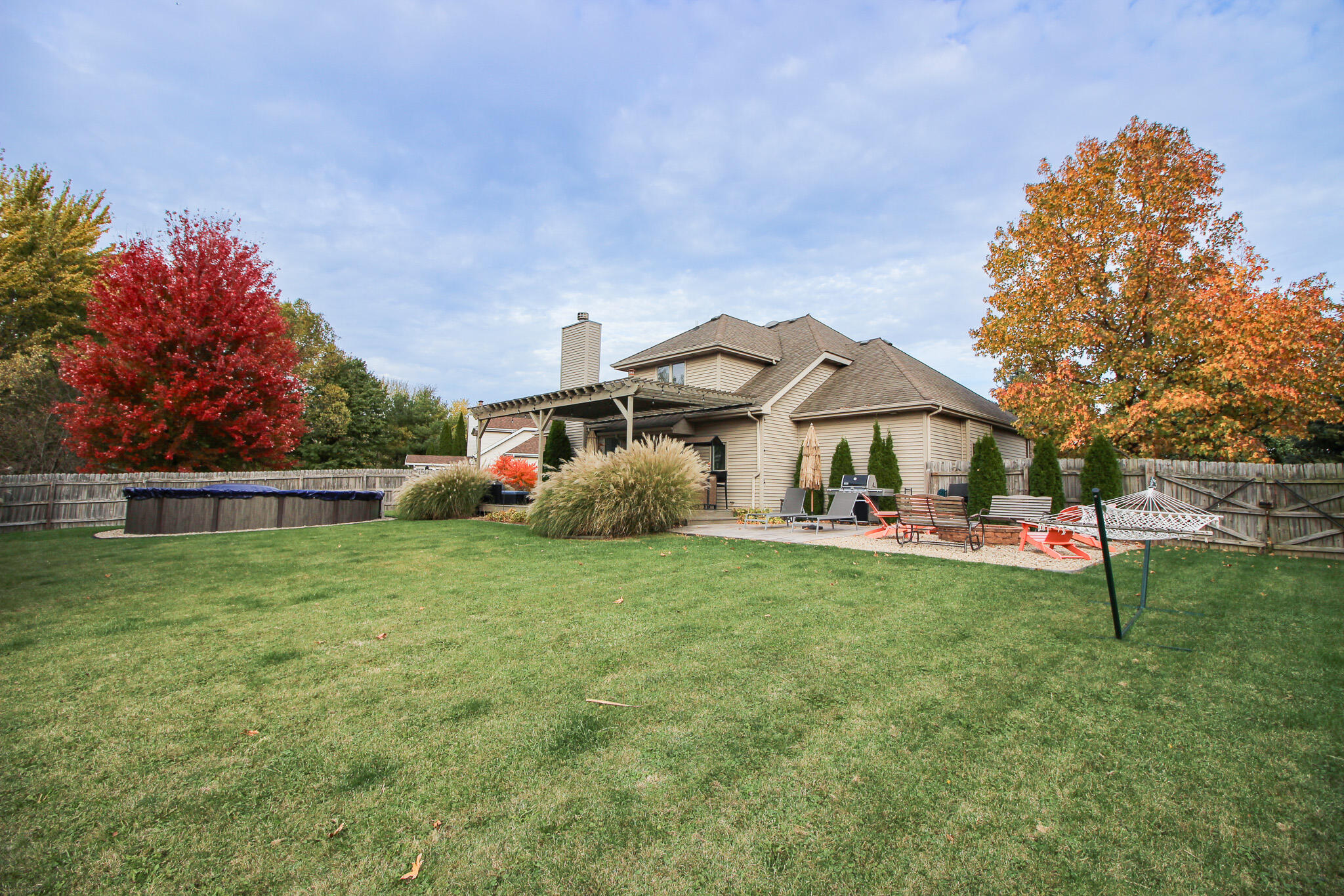1403 Edgewater Road Crown Point, IN 46307 - Photo 34 of 43 a front view of a house with garden