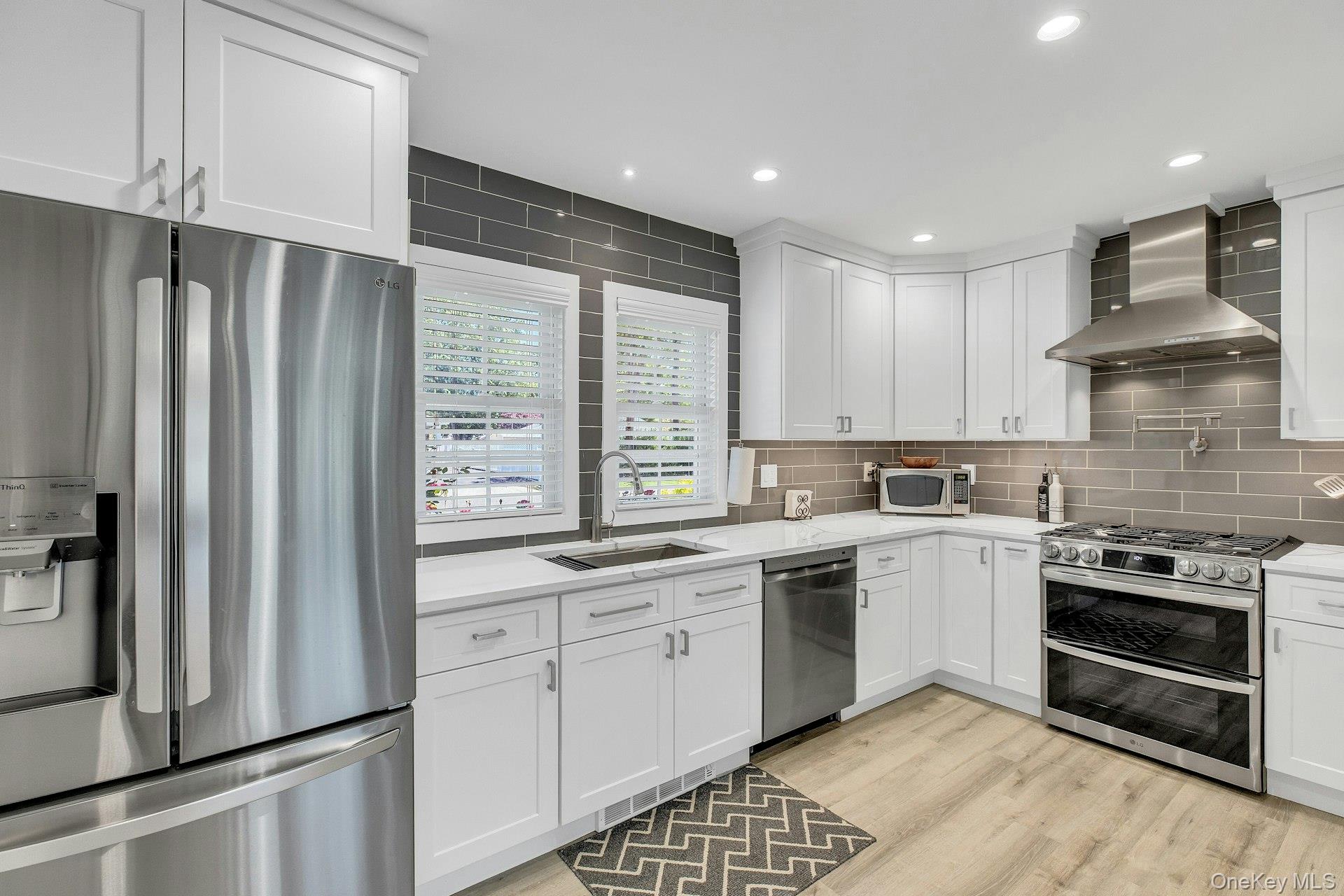 20 Robert Road Glen Cove, NY 11542 - Photo 6 of 23 Newer stainless-steel application stove with pot filler. diswasher, exhaust hood, refregerator.