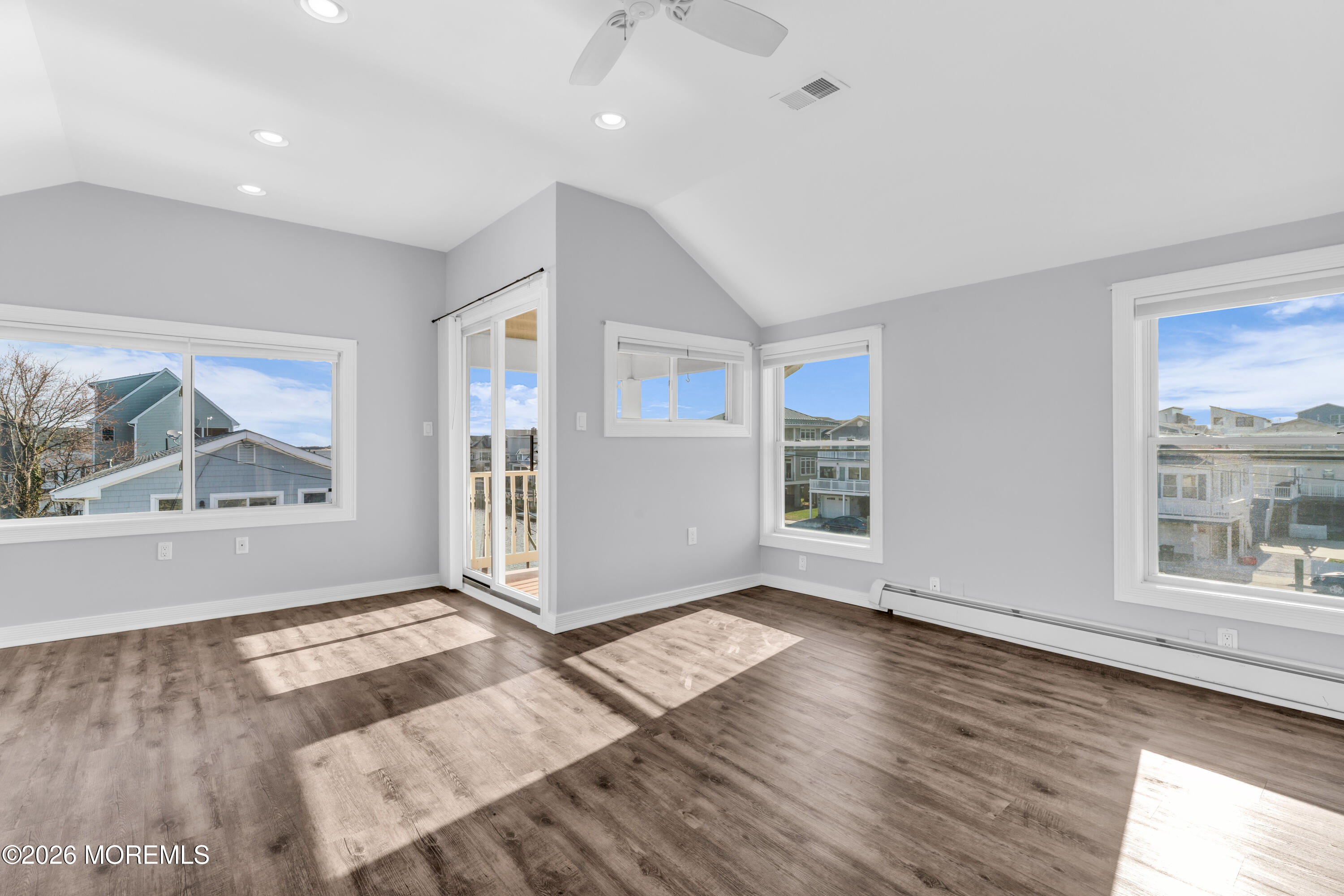 2 Bedle Place Highlands, NJ 07732 - Photo 12 of 25 an empty room with wooden floor and windows