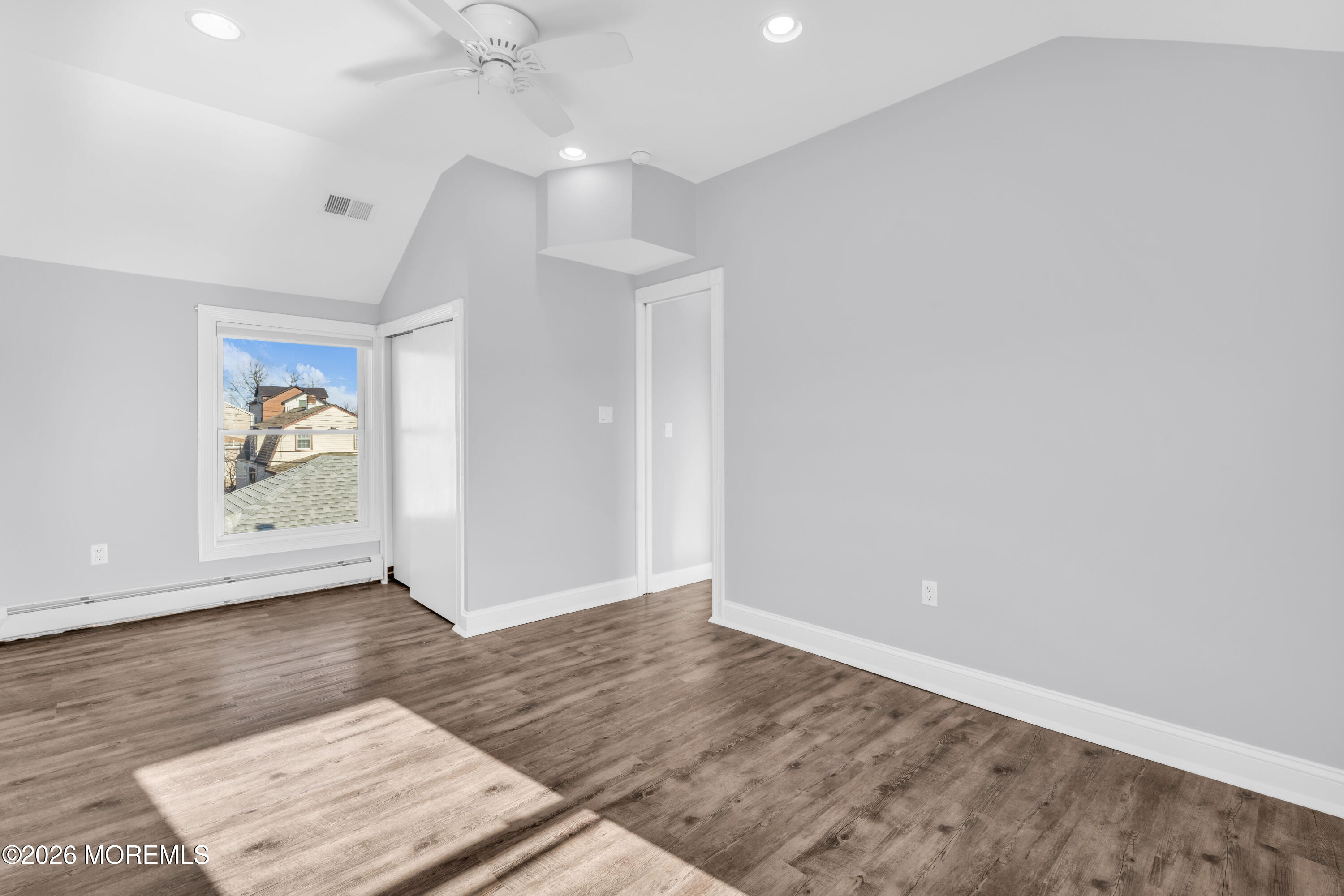 2 Bedle Place Highlands, NJ 07732 - Photo 16 of 25 an empty room with wooden floor and windows