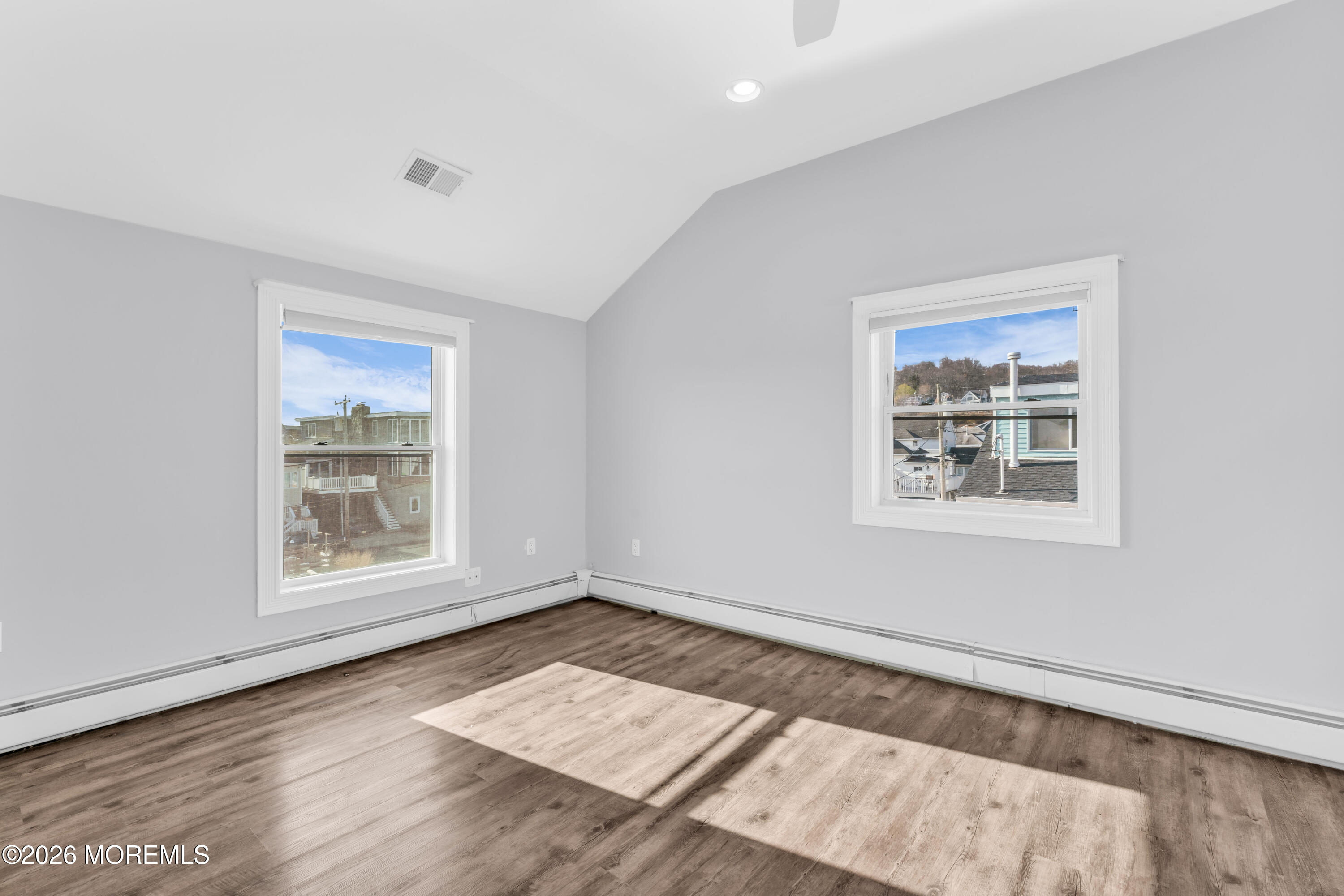 2 Bedle Place Highlands, NJ 07732 - Photo 17 of 25 a view of an empty room with a window and wooden floor