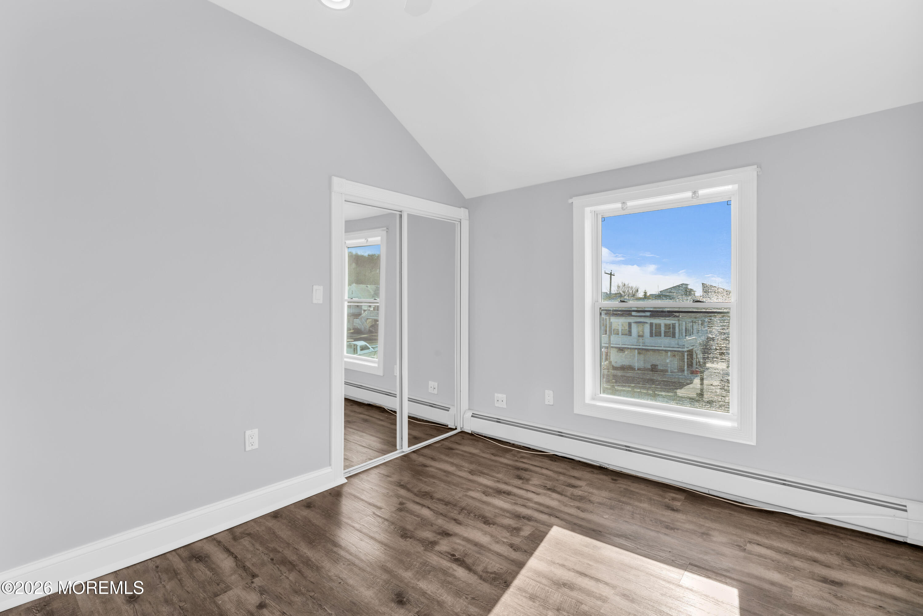 2 Bedle Place Highlands, NJ 07732 - Photo 18 of 25 an empty room with wooden floor and windows