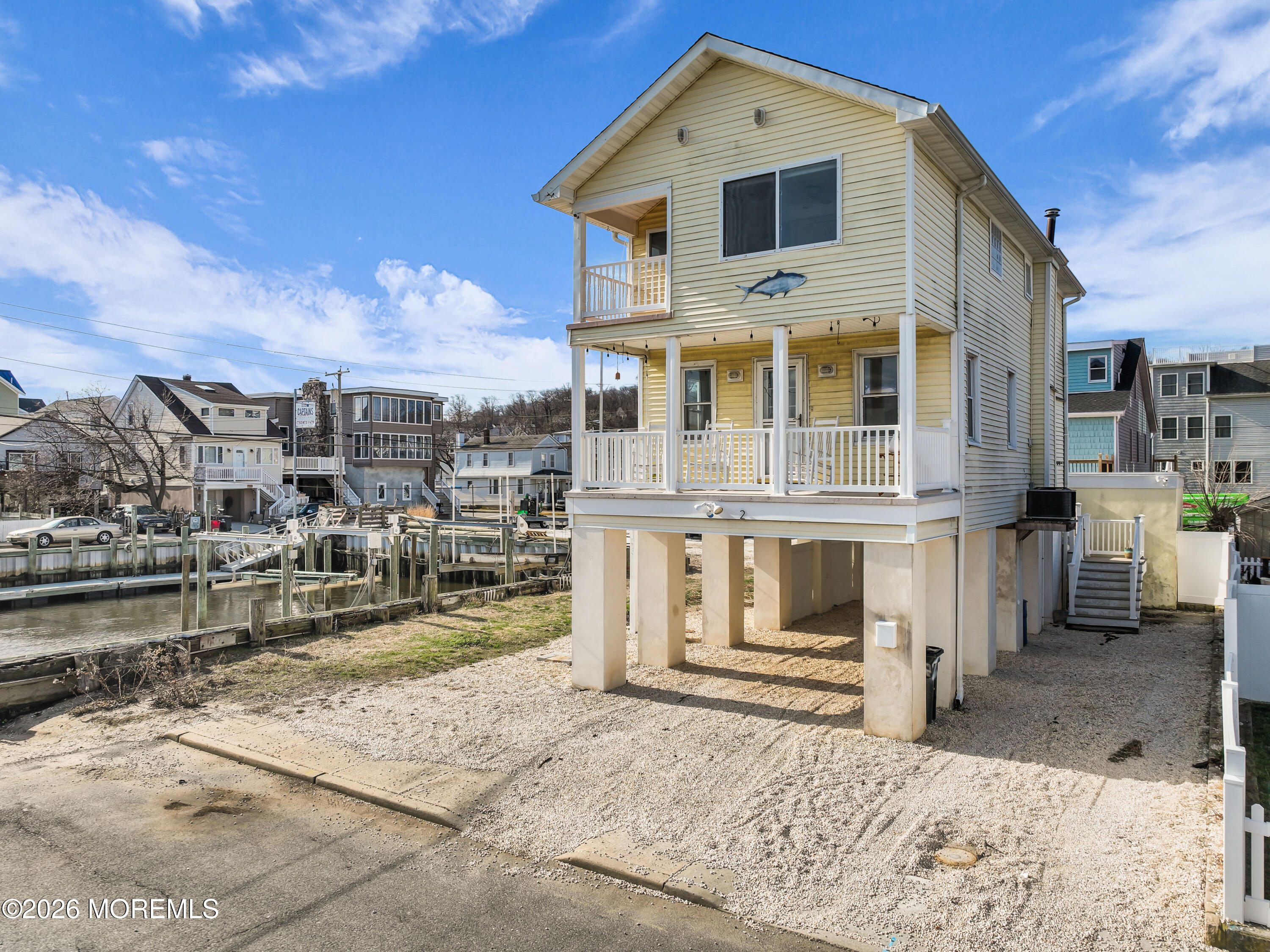 2 Bedle Place Highlands, NJ 07732 - Photo 2 of 25 a front view of a house with a porch