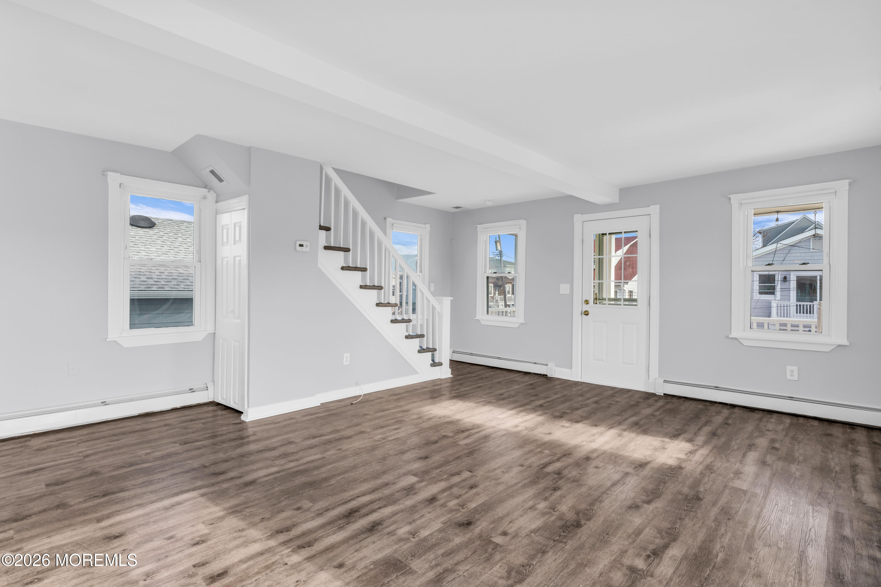 2 Bedle Place Highlands, NJ 07732 - Photo 5 of 25 a view of an empty room with wooden floor and a window