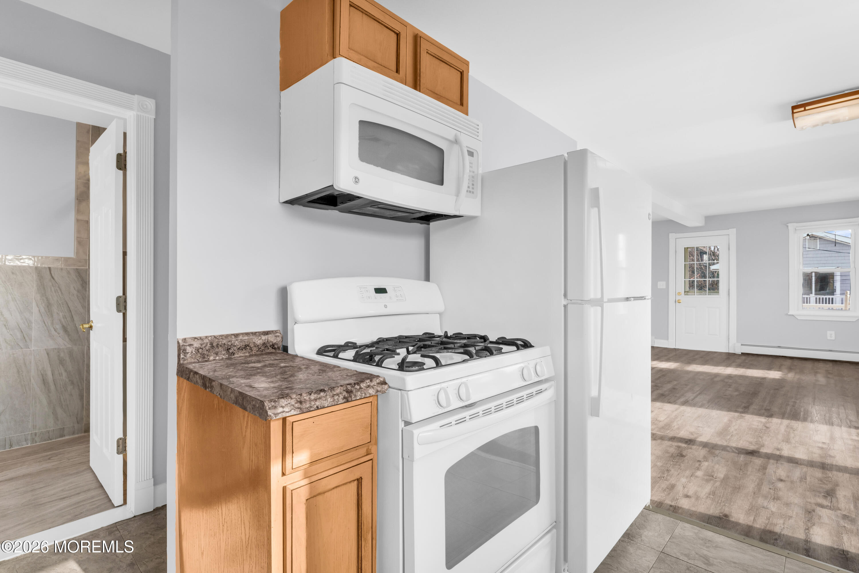 2 Bedle Place Highlands, NJ 07732 - Photo 8 of 25 a kitchen with stainless steel appliances granite countertop a stove and a microwave