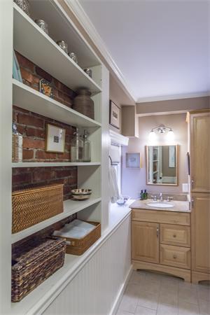 9 Joy Street, Unit 3 Boston, MA 02114 - Photo 12 of 16 a kitchen with a sink stove and cabinets