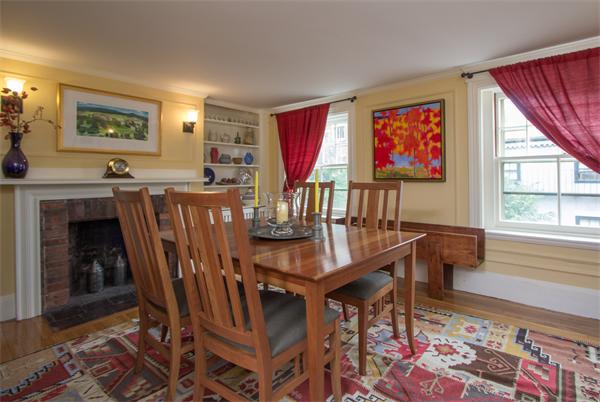 9 Joy Street, Unit 3 Boston, MA 02114 - Photo 7 of 16 a view of a dining room with furniture window and wooden floor