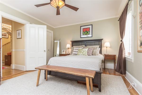 9 Joy Street, Unit 3 Boston, MA 02114 - Photo 8 of 16 a bedroom with a bed and a chandelier