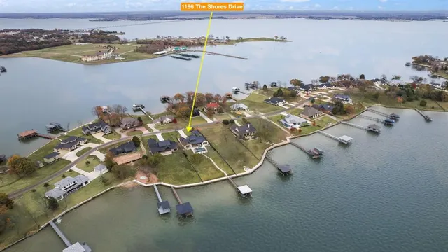 an aerial view of a residential houses with outdoor space