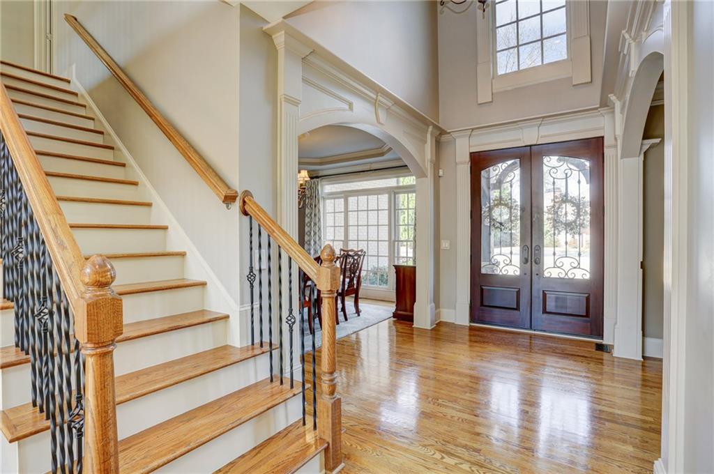 11015 Callington Court Suwanee, GA 30024 - Photo 11 of 87 a view of an entryway with wooden floor and door