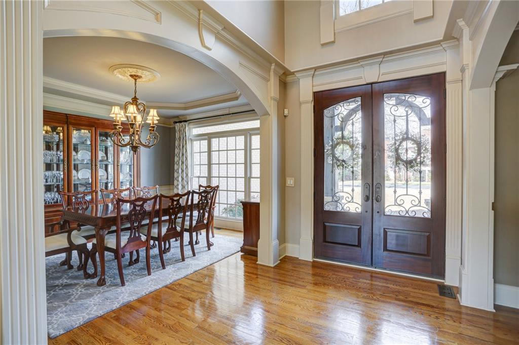 11015 Callington Court Suwanee, GA 30024 - Photo 12 of 87 a view of a dining room with furniture window and wooden floor