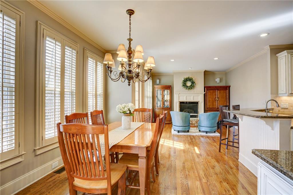 11015 Callington Court Suwanee, GA 30024 - Photo 26 of 87 a view of a dining room with furniture wooden floor and chandelier