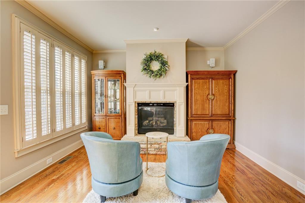 11015 Callington Court Suwanee, GA 30024 - Photo 27 of 87 a living room with furniture a window and a fireplace