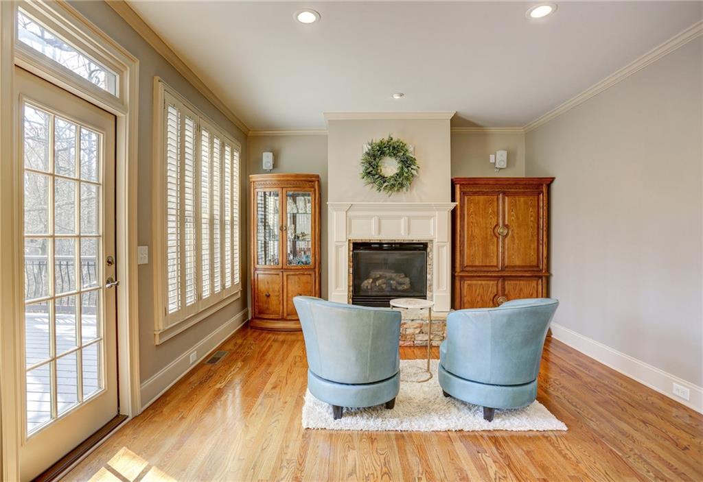 11015 Callington Court Suwanee, GA 30024 - Photo 28 of 87 a living room with furniture a fireplace and a potted plant