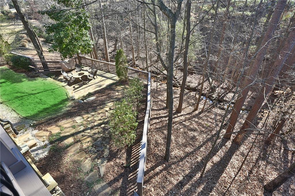 11015 Callington Court Suwanee, GA 30024 - Photo 38 of 87 a backyard of a house with lots of green space