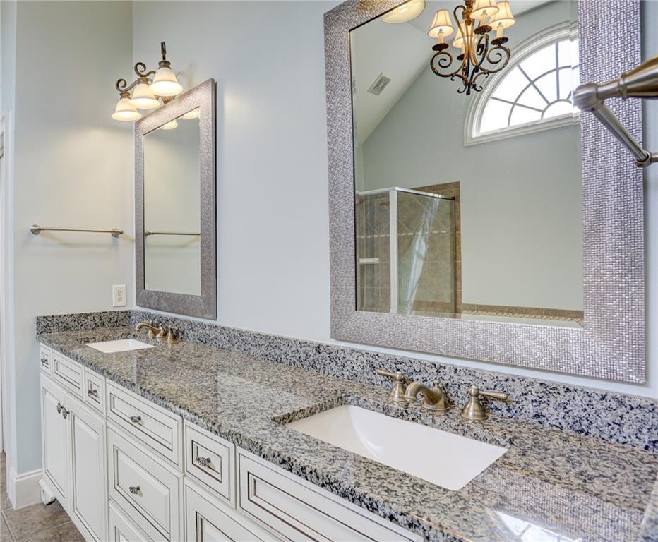 11015 Callington Court Suwanee, GA 30024 - Photo 49 of 87 a bathroom with a granite countertop sink and a mirror