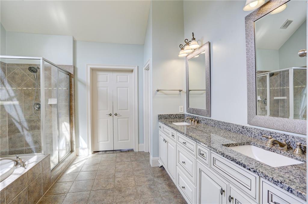 11015 Callington Court Suwanee, GA 30024 - Photo 51 of 87 a bathroom with a granite countertop sink and a mirror