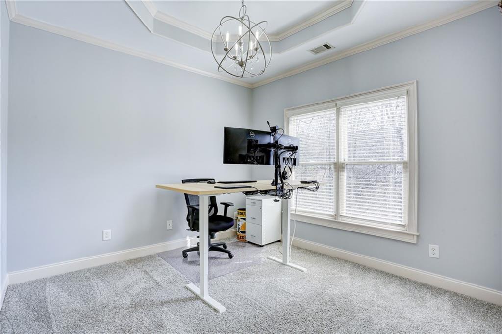 11015 Callington Court Suwanee, GA 30024 - Photo 56 of 87 a view of a workspace with furniture and a window