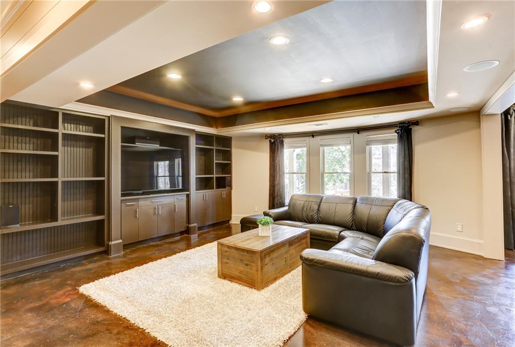 11015 Callington Court Suwanee, GA 30024 - Photo 67 of 87 a living room with furniture and a flat screen tv