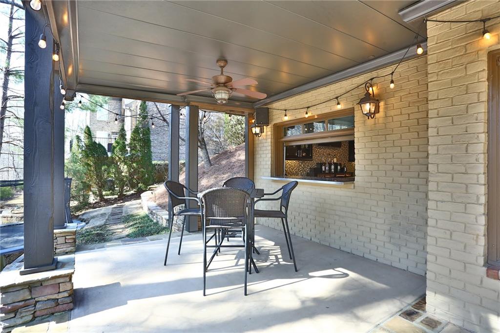 11015 Callington Court Suwanee, GA 30024 - Photo 74 of 87 a patio with table and chairs and potted plants