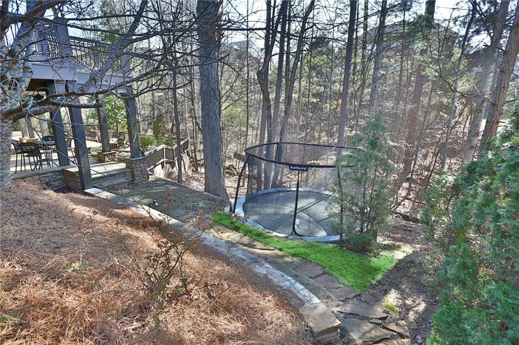 11015 Callington Court Suwanee, GA 30024 - Photo 87 of 87 a backyard of a house with table and chairs